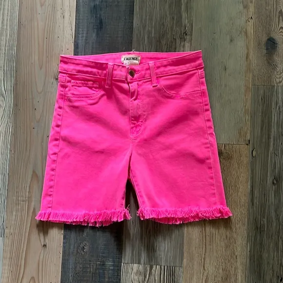 L’Agence Margot Mid Rise Cropped Raw Hem Jean SHORTS in Flamingo Pink Size: 27